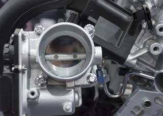 The closed up of throttle body and engine