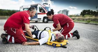 Rescue team helping injured man