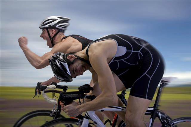 Two male cyclists competing to be the winner
