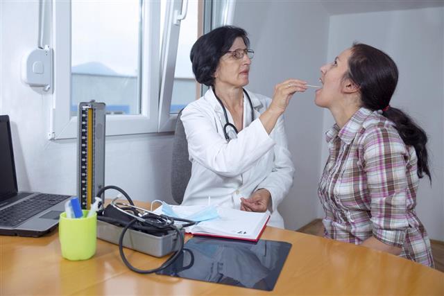 Female doctor examining her patient