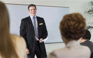 Businessman giving speech during conference or business seminar event