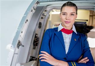 Flight attendant in the plane