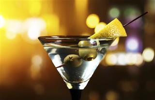Martini with lemon and green olives