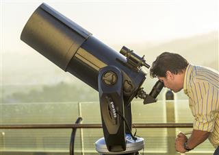 Man using a telescope