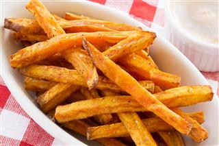 Sweet potato fries with dip and checkered napkin