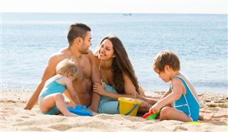 Family Enjoying Time At The Beach