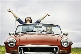 Happy Young People In A Cabriolet