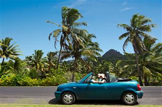 Couple Travel By Car In Tropical Island