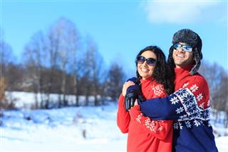 Young Couple Enjoying The Snow Vacations