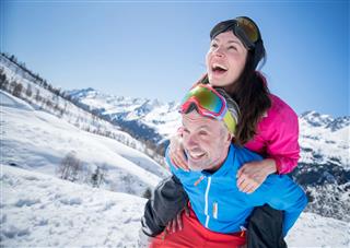 Happy Couple Having Fun Skiing