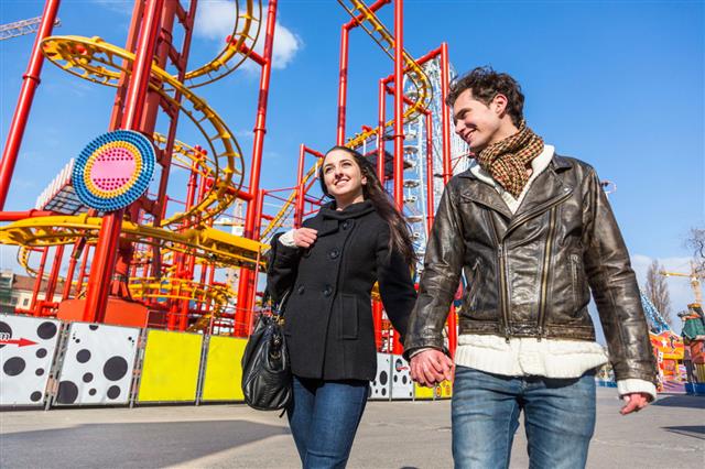 Young Couple At Amusement Park
