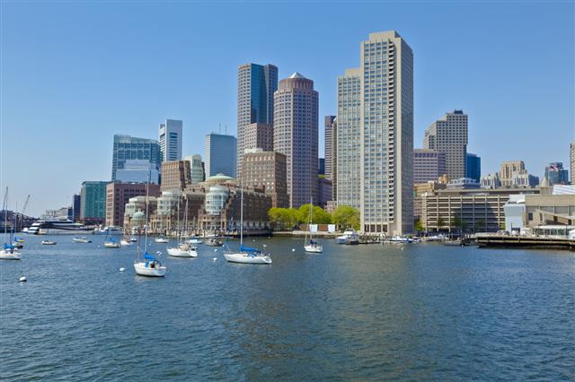 Boston Harbor Cityscape With Anchored Sailboats