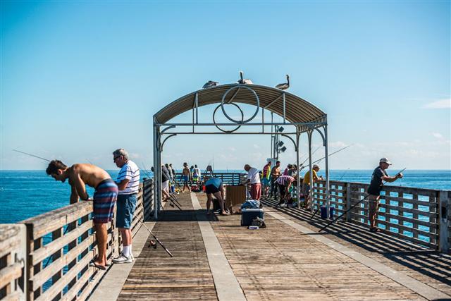 People Fishing From The Pier