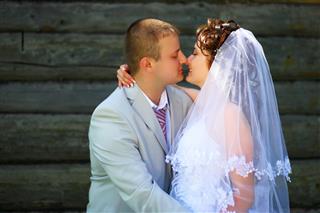 Kissing Groom And Bride