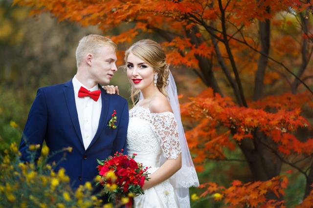 Happy Couple In Autumn Forest