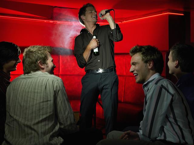Men Singing In A Bar