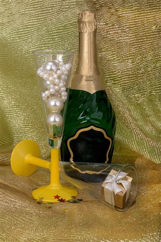 Champagne And Glasses With Gift