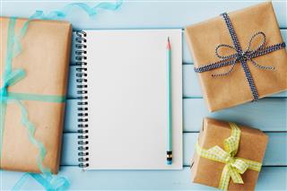 Empty notebook and gift