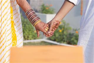 Indian Married Couple holding hands
