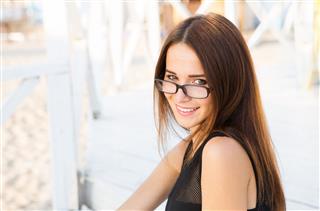 Young Female Student In Reading Glasses