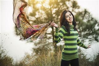 Woman Flying Scarf In Nature