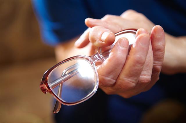 Old Woman Hands With Eyeglasses