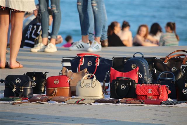Handbags On Beach