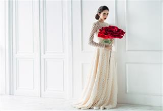 Young Beautiful Bride With Big Rose