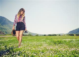 Beautiful Woman Walking In Grass