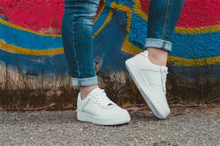 White Sneakers On Girl Legs