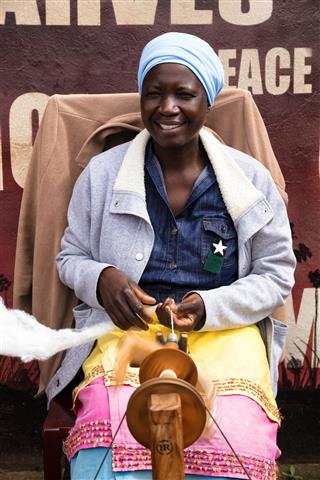 African Woman Spins Wool