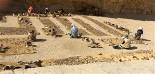 Archaeologists Working With Prehistoric Pottery